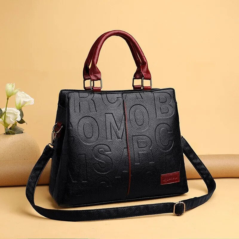 2023 New Fashion Solid Color Shoulder Large Capacity Soft Leather Cloth Letter Embossed Ladies Handbag